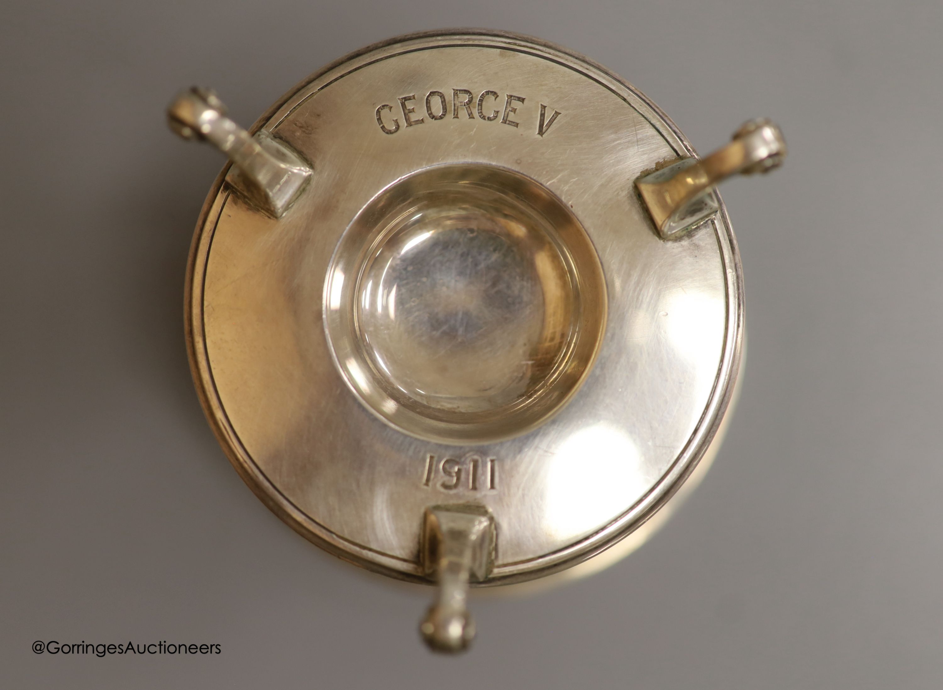 A George V novelty silver salt, modelled a s a font, with engraved inscription relating to the Company of Inhoulders, London, 1911, height 68mm, together with an Edwardian silver and tortoiseshell pique mounted trinket b